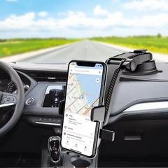 Black car mount holding phone securely on dashboard in bright daylight